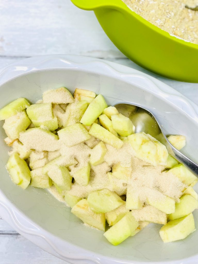 chopped apples coated in cinnamon sugar for making apple crumble