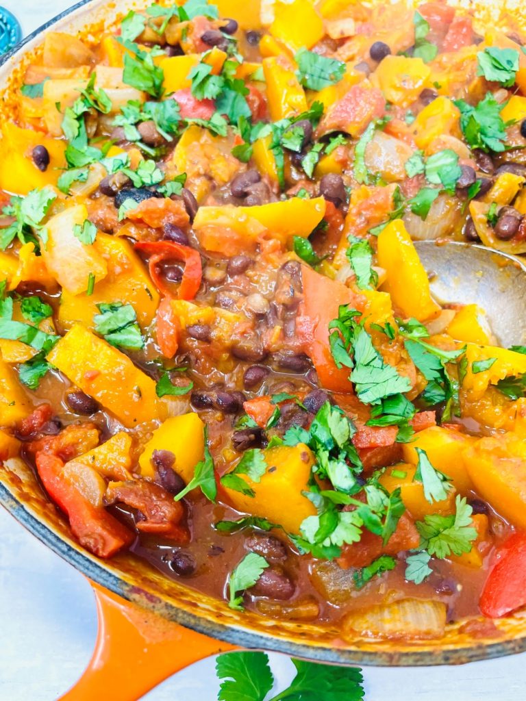 close up image of butternut squash chilli scattered with chopped coriander
