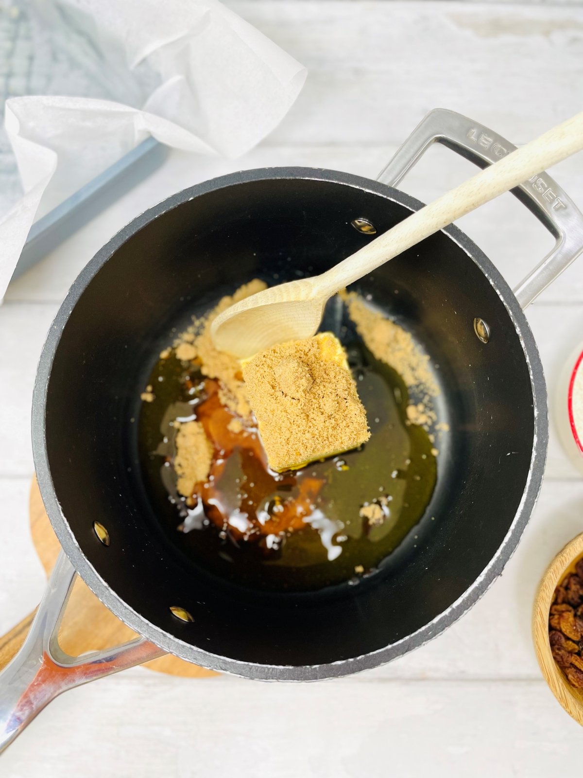 butter, syrup and brown sugar melting in a le creuset saucepan